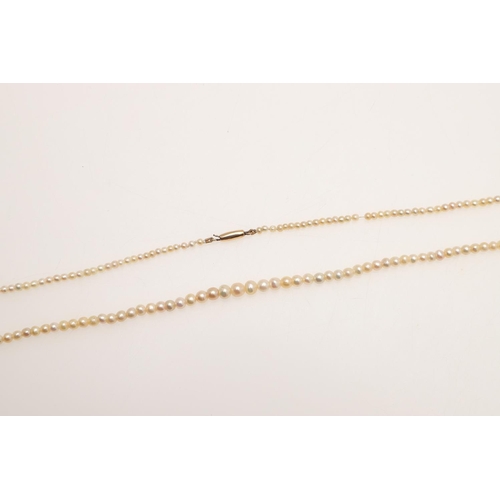 239 - A SINGLE ROW GRADUATED NATURAL PEARL NECKLACE. the one hundred and sixty one pearls graduate from 2.... 