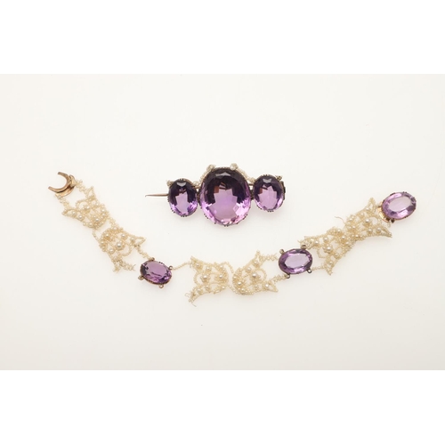 245 - A VICTORIAN AMETHYST AND SEED PEARL SUITE OF JEWELLERY. comprising an amethyst brooch formed with th... 