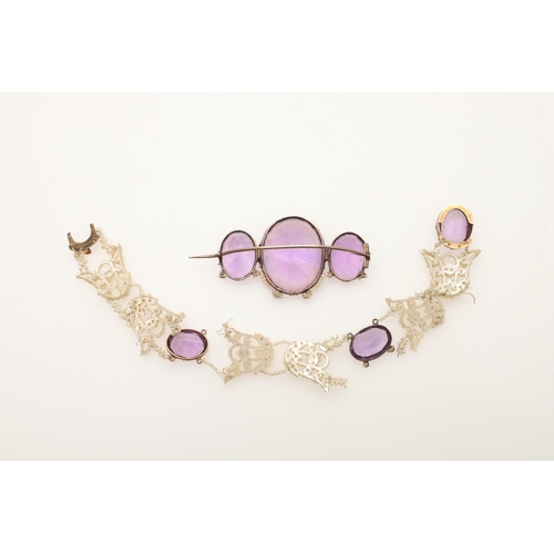 245 - A VICTORIAN AMETHYST AND SEED PEARL SUITE OF JEWELLERY. comprising an amethyst brooch formed with th... 