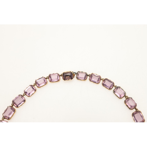 249 - AN VICTORIAN AMETHYST RIVIERE NECKLACE. mounted with graduated rectangular-shaped amethysts, in gold... 