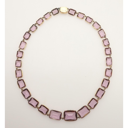 249 - AN VICTORIAN AMETHYST RIVIERE NECKLACE. mounted with graduated rectangular-shaped amethysts, in gold... 