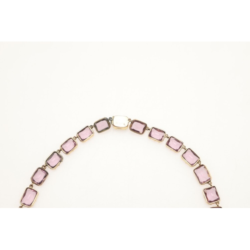 249 - AN VICTORIAN AMETHYST RIVIERE NECKLACE. mounted with graduated rectangular-shaped amethysts, in gold... 