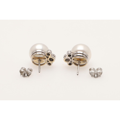 256 - A PAIR OF CULTURED PEARL AND DIAMOND EARRINGS. each earring set with a pearl measuring approximately... 