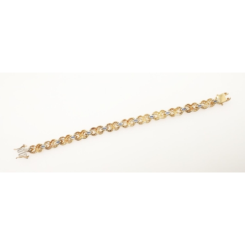 258 - A SAPPHIRE AND DIAMOND BRACELET. formed with marquise-cut sapphires, each divided by a diamond set c... 