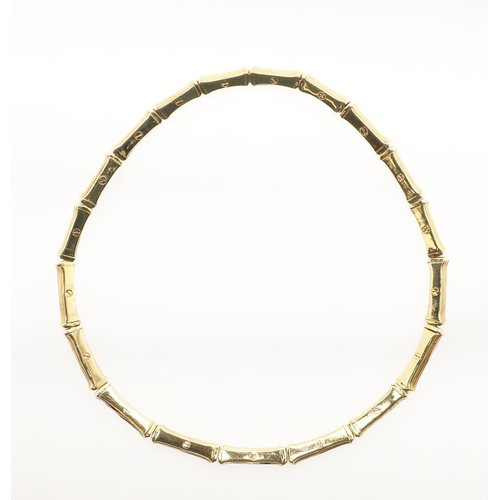 259 - A DIAMOND AND 18CT GOLD COLLAR NECKLACE. formed with textured links of bamboo design, with three dia... 