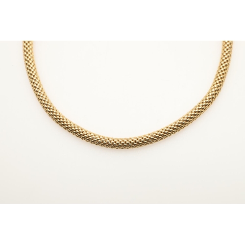 261 - AN 18CT GOLD WOVEN TUBULAR NECKLACE. 42.5cm long, 50 grams.