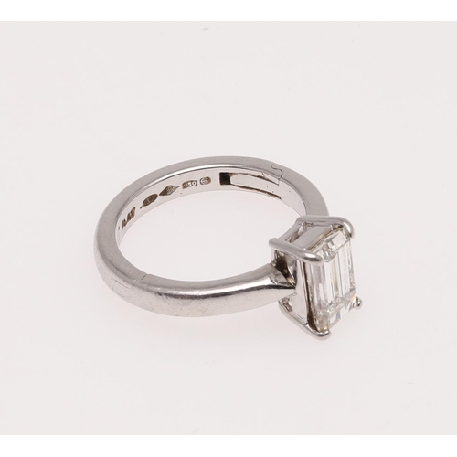 266 - A DIAMOND SOLITAIRE RING. mounted with an emerald-cut diamond weighing 1.55 carats in platinum, 6.9 ... 