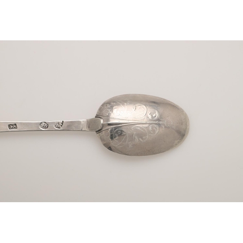 27 - A WILLIAM & MARY SILVER LACE-BACK TREFID SPOON. with a ribbed rattail and foliate scroll decoration,... 