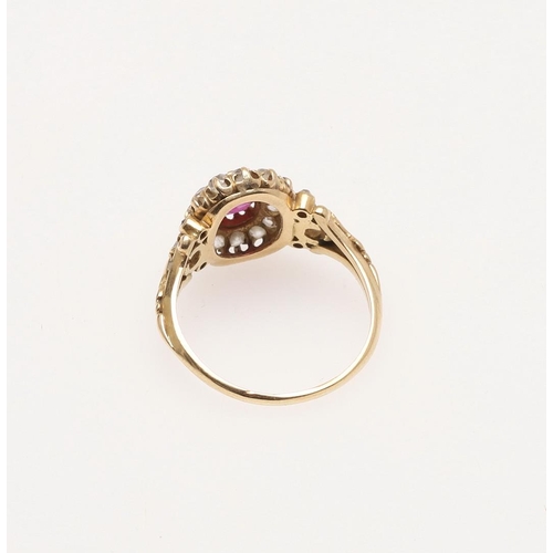 270 - A VICTORIAN RUBY AND DIAMOND CLUSTER RING. the oval-shaped ruby is set within a surround of cushion ... 