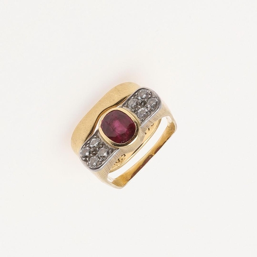 273 - A RUBY AND DIAMOND RING BY ANDREW GRIMA. the oval-shaped ruby is millegrain set with four circular-c... 