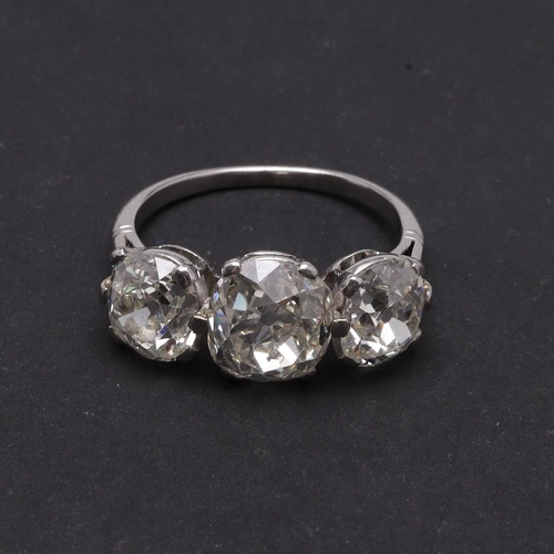 278 - A DIAMOND THREE STONE RING. mounted with three cushion-shaped old cut diamonds measuring approximate... 