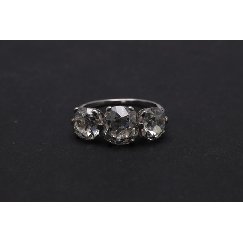 278 - A DIAMOND THREE STONE RING. mounted with three cushion-shaped old cut diamonds measuring approximate... 