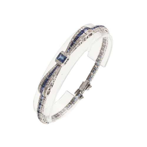 280 - AN ART DECO SAPPHIRE AND DIAMOND BRACELET. designed as a stylised bow set with a rectangular-shaped ... 