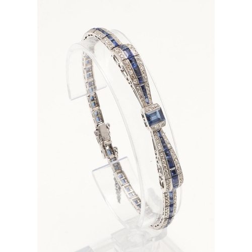 280 - AN ART DECO SAPPHIRE AND DIAMOND BRACELET. designed as a stylised bow set with a rectangular-shaped ... 