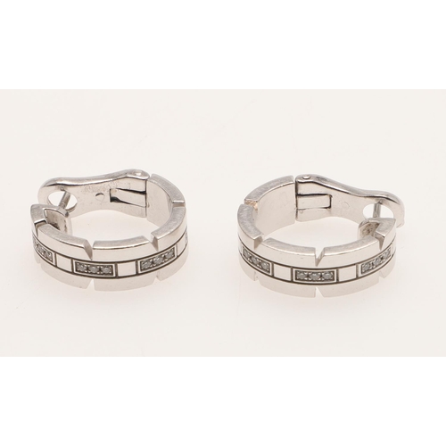 288 - A PAIR OF DIAMOND AND 18CT WHITE GOLD HOOP EARRINGS BY CARTIER. mounted with sections of circular-cu... 