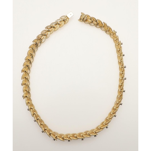 291 - AN 18CT GOLD AND DIAMOND NECKLACE BY RAYMOND YARD. of overlapping leaf design, mounted with circular... 