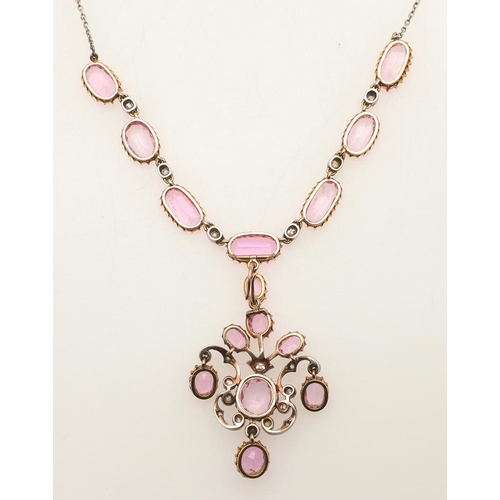 292 - A VICTORIAN PINK TOPAZ AND DIAMOND NECKLACE AND PENDANT. the scrolling openwork pendant centred with... 