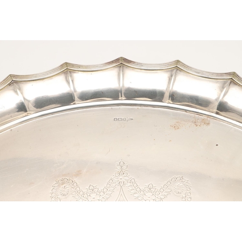 43 - A LATE VICTORIAN TWO-HANDLED SILVER TRAY. of shaped oval outline, with a reeded border and initialle... 