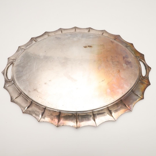 43 - A LATE VICTORIAN TWO-HANDLED SILVER TRAY. of shaped oval outline, with a reeded border and initialle... 