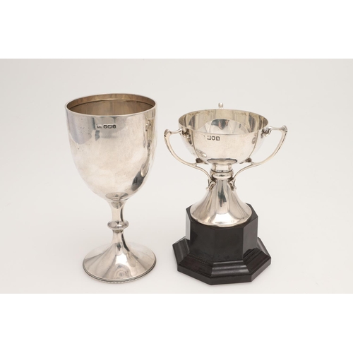 46 - A GEORGE V SILVER GOBLET. with a campana shaped bowl, a baluster stem and on a circular foot, the wh... 