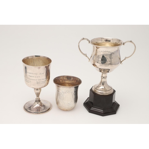 46 - A GEORGE V SILVER GOBLET. with a campana shaped bowl, a baluster stem and on a circular foot, the wh... 