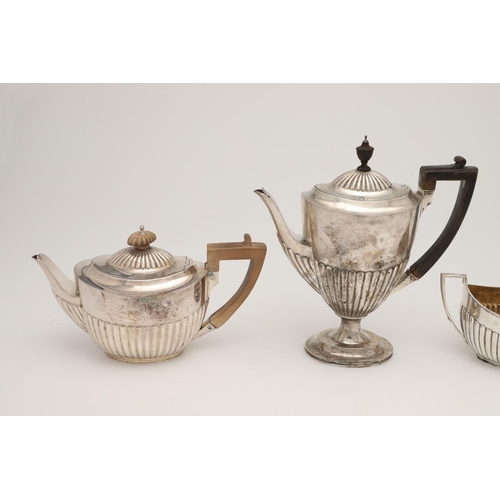 50 - A VICTORIAN FOUR-PIECE SILVER TEA & COFFEE SERVICE. oval form, with angular handles and fluted lower... 