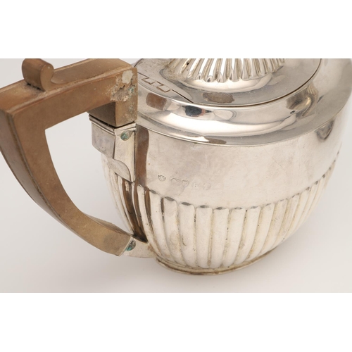 50 - A VICTORIAN FOUR-PIECE SILVER TEA & COFFEE SERVICE. oval form, with angular handles and fluted lower... 