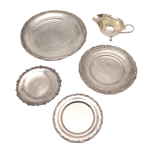 55 - 20TH CENTURY EGYPTIAN SILVER. a dinner plate, side plate, two smaller plates and a sauce boat, all C... 