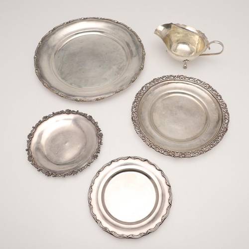 55 - 20TH CENTURY EGYPTIAN SILVER. a dinner plate, side plate, two smaller plates and a sauce boat, all C... 