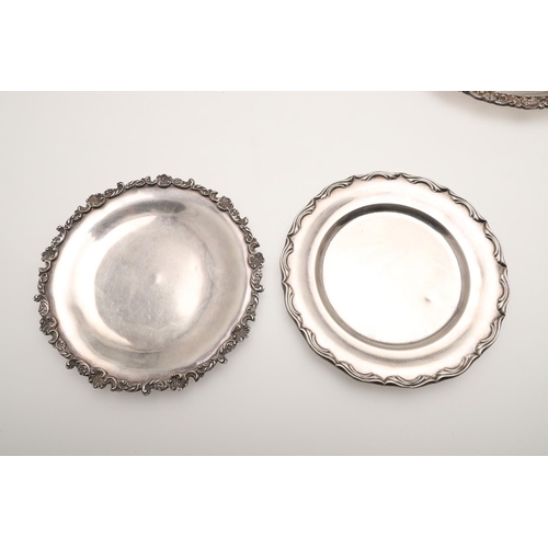 55 - 20TH CENTURY EGYPTIAN SILVER. a dinner plate, side plate, two smaller plates and a sauce boat, all C... 