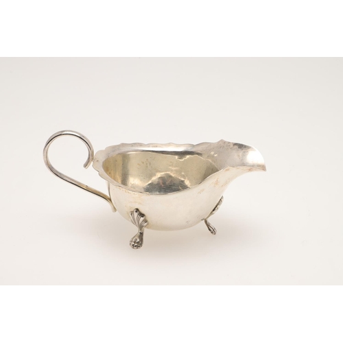 55 - 20TH CENTURY EGYPTIAN SILVER. a dinner plate, side plate, two smaller plates and a sauce boat, all C... 