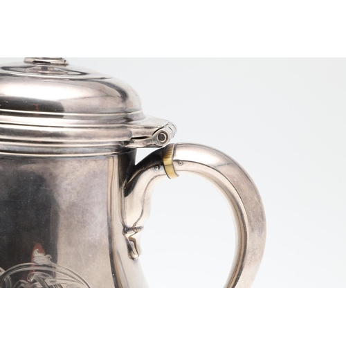 61 - A GEORGE V SILVER HOT WATER JUG. of baluster form, with a scroll handle, knop finial and raised on a... 