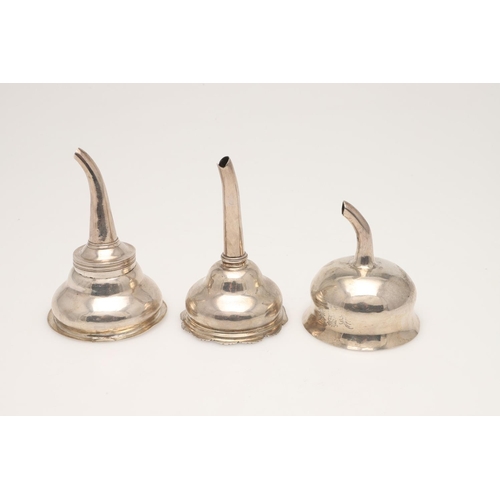 66 - THREE SILVER WINE FUNNELS. one with a reeded border, by Charles Aldridge & Henry Green, London 1773,... 