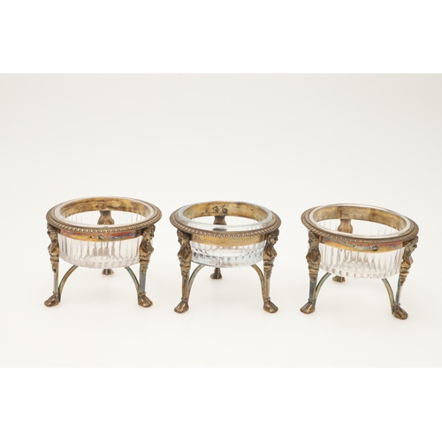 68 - A 19TH CENTURY FRENCH SILVERGILT FOUR-PIECE CONDIMENT SET. a mustard pot & three salts of circular f... 