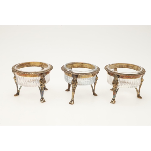 68 - A 19TH CENTURY FRENCH SILVERGILT FOUR-PIECE CONDIMENT SET. a mustard pot & three salts of circular f... 