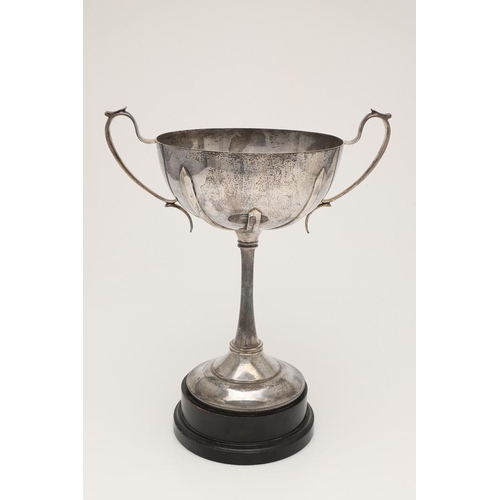 71 - A GEORGE V TWO-HANDLED SILVER CUP. of circular form, the bowl with applied bands, scroll handles and... 