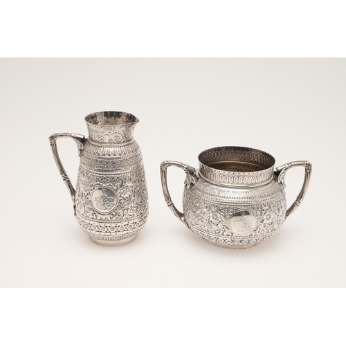 72 - A LATE VICTORIAN FOUR-PIECE SILVER TEA & COFFEE SERVICE. of circular form, with naturalistic handles... 