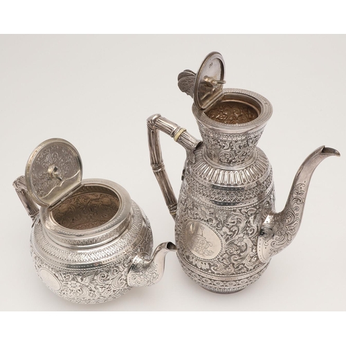 72 - A LATE VICTORIAN FOUR-PIECE SILVER TEA & COFFEE SERVICE. of circular form, with naturalistic handles... 