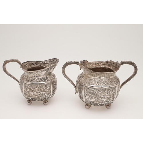 73 - AN INDIAN FOUR-PIECE SILVER TEA & COFFEE SERVICE. of panelled oval form, with elephant finials, scro... 