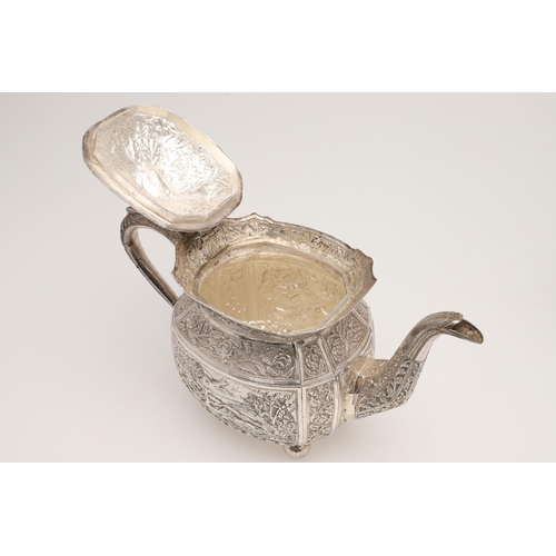 73 - AN INDIAN FOUR-PIECE SILVER TEA & COFFEE SERVICE. of panelled oval form, with elephant finials, scro... 