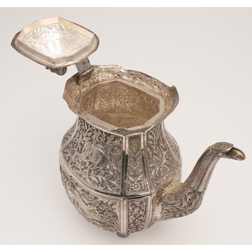 73 - AN INDIAN FOUR-PIECE SILVER TEA & COFFEE SERVICE. of panelled oval form, with elephant finials, scro... 