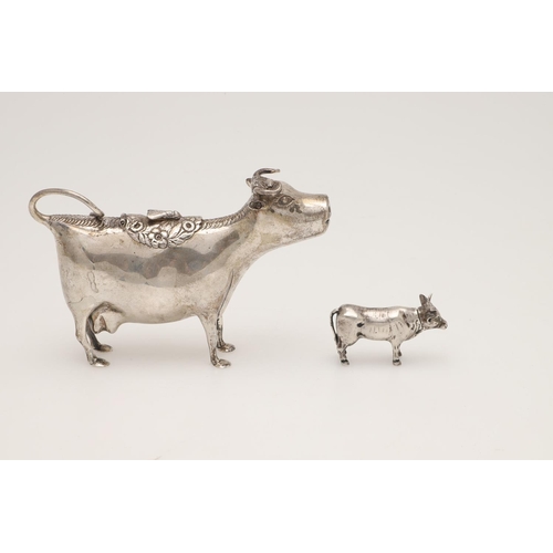 74 - A 19TH CENTURY FRENCH SILVER COW CREAMER. the floral hinged cover with an applied fly, makers mark i... 