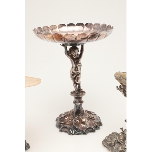 75 - AN EDWARDIAN SILVER PLATED CENTREPIECE. on a foliate scrolling base, with a cherubic figure column s... 