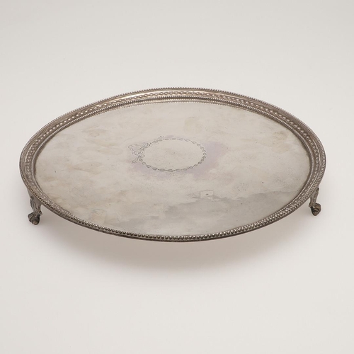 76 - A GEORGE III SILVER SALVER. circular outline, with bead borders, engraved in the centre with a vacan... 