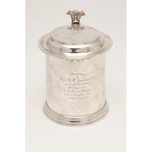 77 - A LATE VICTORIAN SILVER TANKARD. in the style of a late 17th century example, crested & inscribed 