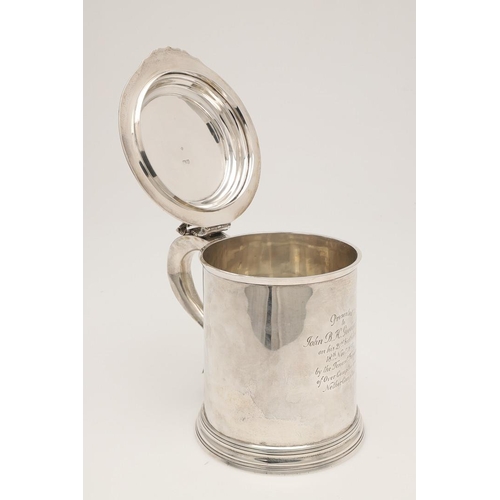 77 - A LATE VICTORIAN SILVER TANKARD. in the style of a late 17th century example, crested & inscribed 