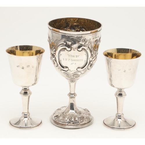 78 - A PAIR OF ELIZABETH II SILVER WINE GOBLETS. with knopped stems and campana-shaped bowls, gilt interi... 