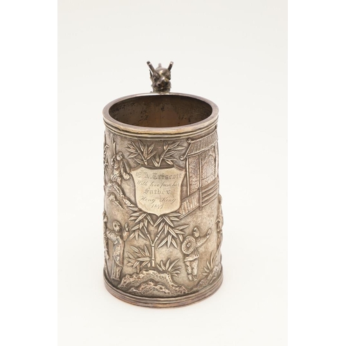 80 - A LATE 19TH CENTURY CHINESE SILVER MUG. of tapering circular form, with a dragon handle and the body... 