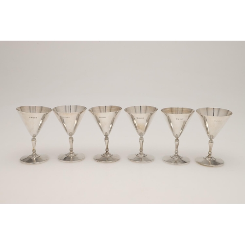 84 - A SET OF SIX GEORGE V SMALL SILVER GOBLETS. with conical bowls, knopped stems and on circular feet, ... 