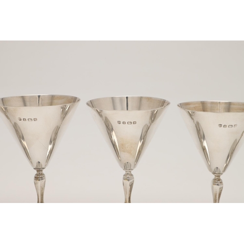 84 - A SET OF SIX GEORGE V SMALL SILVER GOBLETS. with conical bowls, knopped stems and on circular feet, ... 